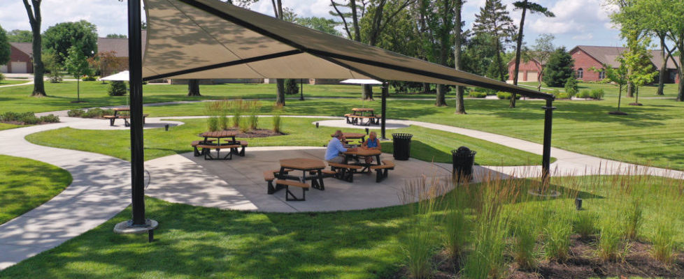 Couple sitting under awning in Village Park